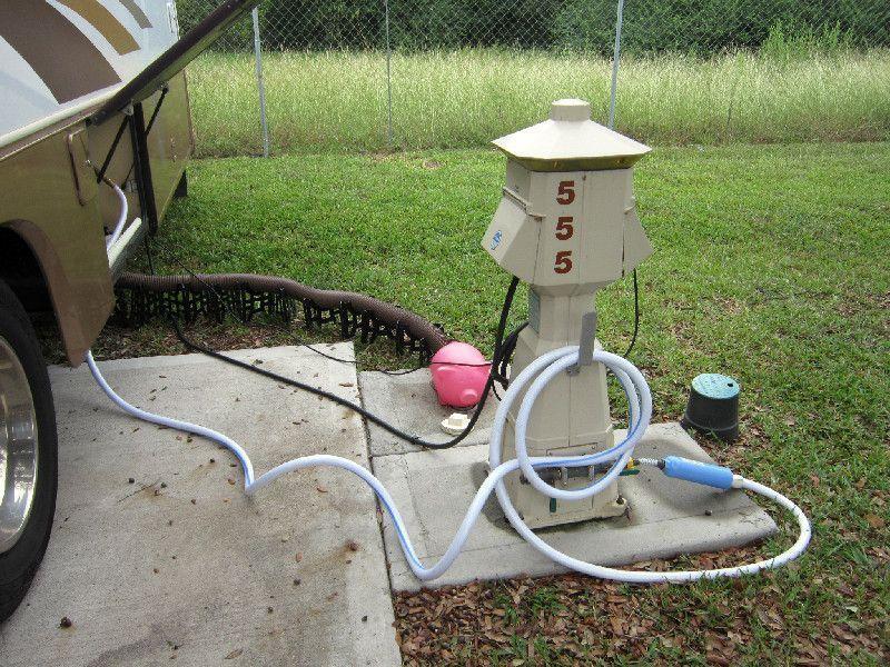 RV site with electrical, water, and sewer hookups showing essential campground utilities.