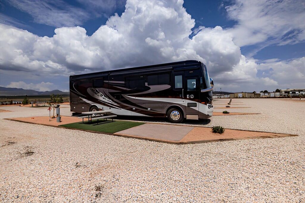 Large RV using a spacious pull-through campsite with full hookups