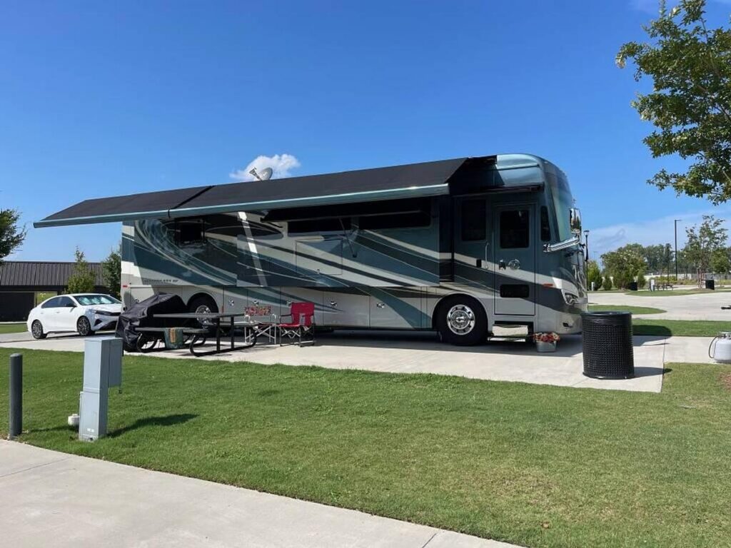 Large 40-foot motorhome with plenty of clearance at an RV campground